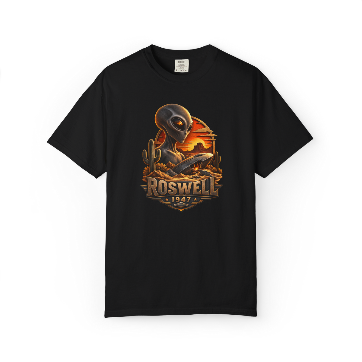 Black Roswell 1947 alien shirt featuring a grey extraterrestrial and crashed UFO in the New Mexico desert at sunset