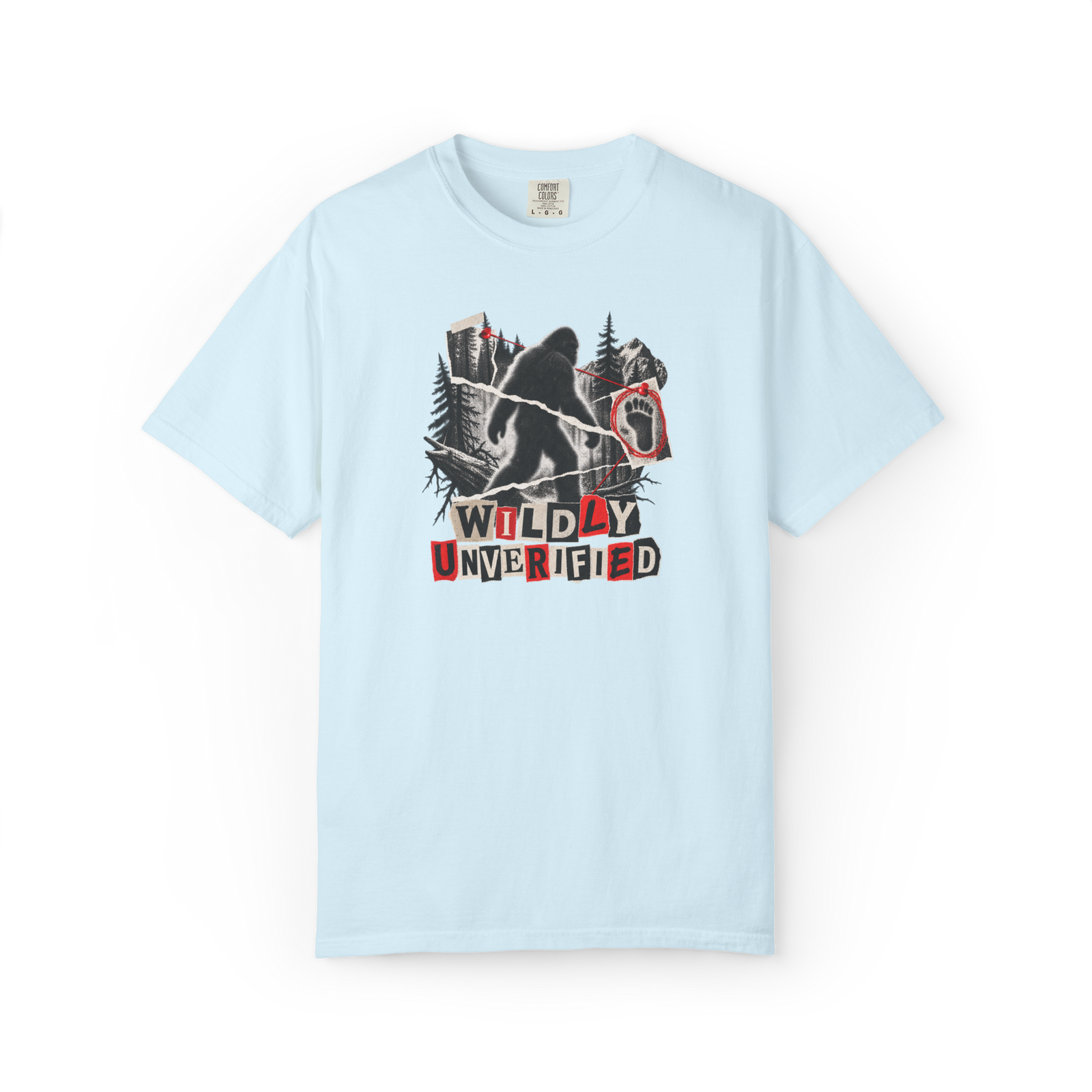Light blue Bigfoot shirt with Sasquatch silhouette, forest collage, footprint evidence, red markings, and Wildly Unverified tex