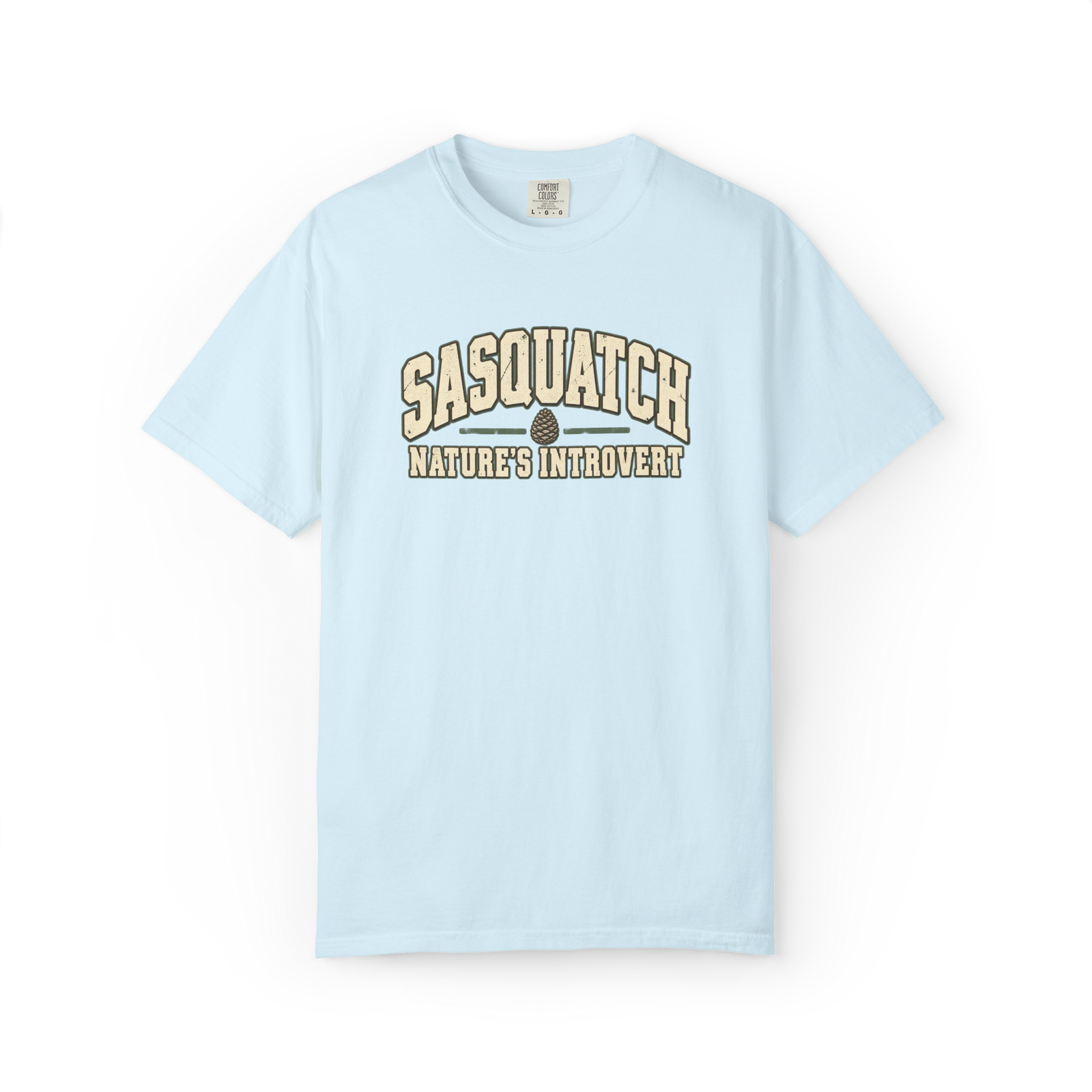 Light blue Sasquatch t shirt with vintage collegiate Sasquatch lettering, pine cone graphic, and Nature’s Introvert text
