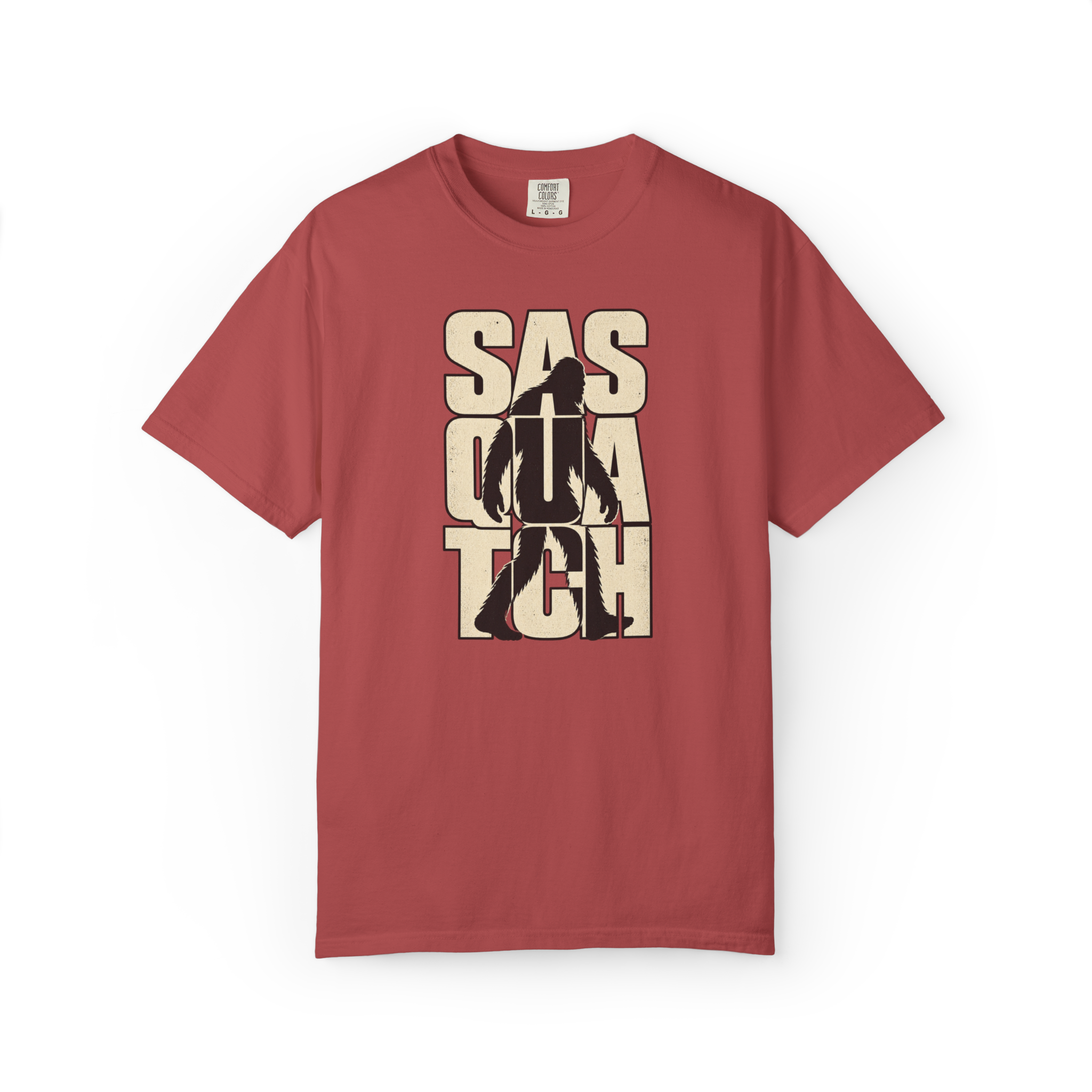 Crimson Sasquatch t shirt featuring a black walking Bigfoot silhouette over large distressed cream Sasquatch lettering