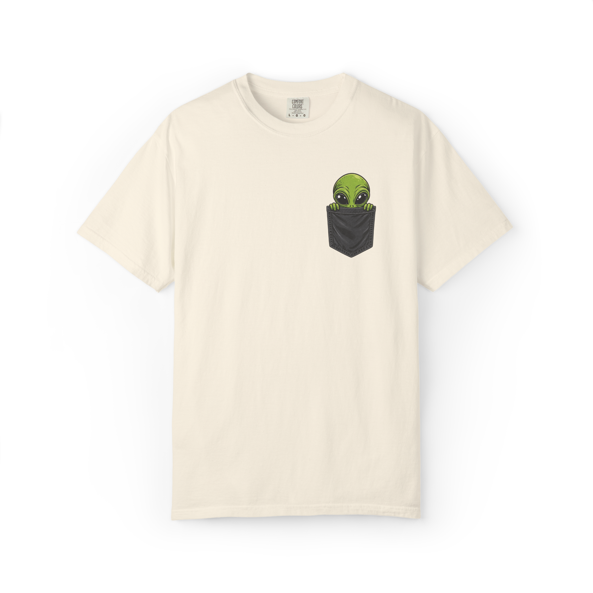 Ivory alien shirt featuring a green alien peeking out of a black pocket graphic