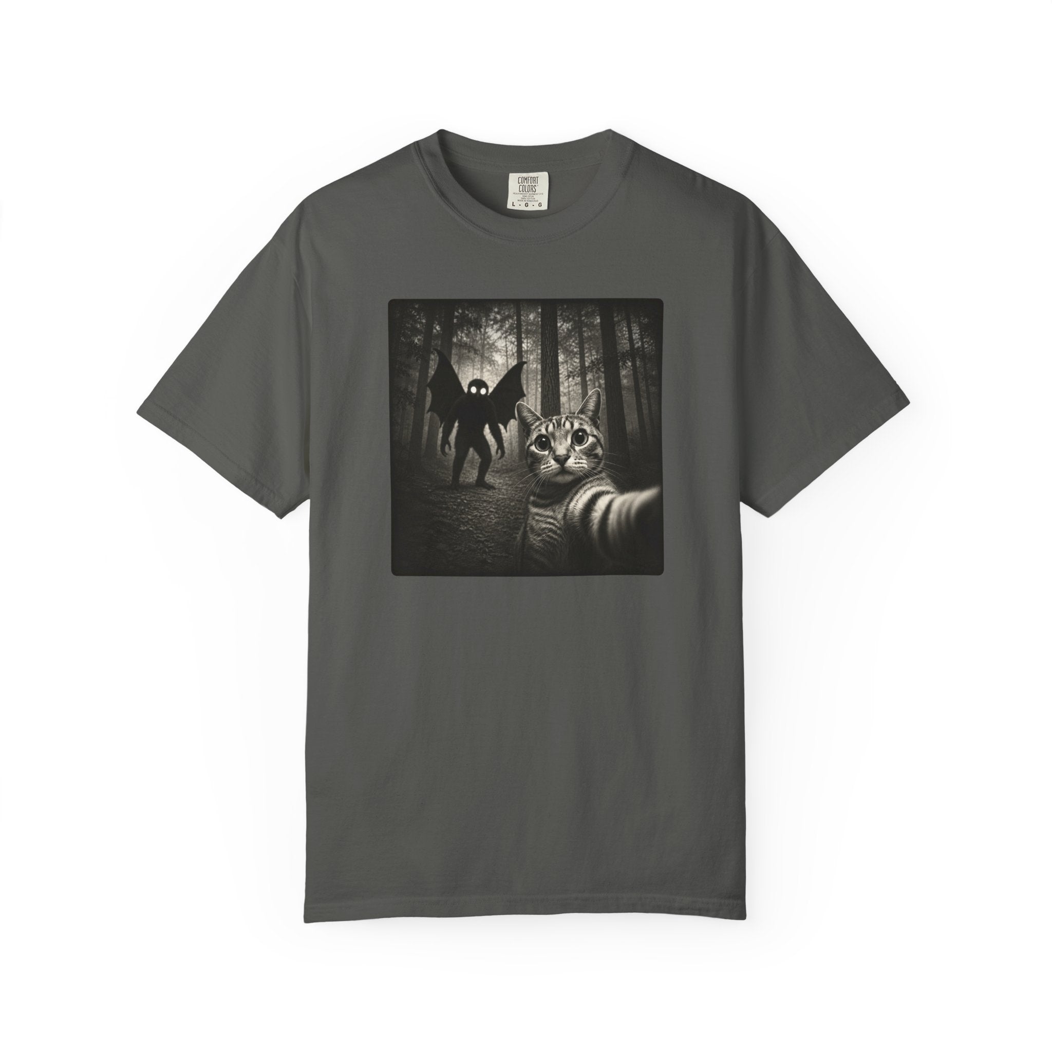 Scared cat selfie with Mothman T-shirt featuring black and white cryptid photo artwork