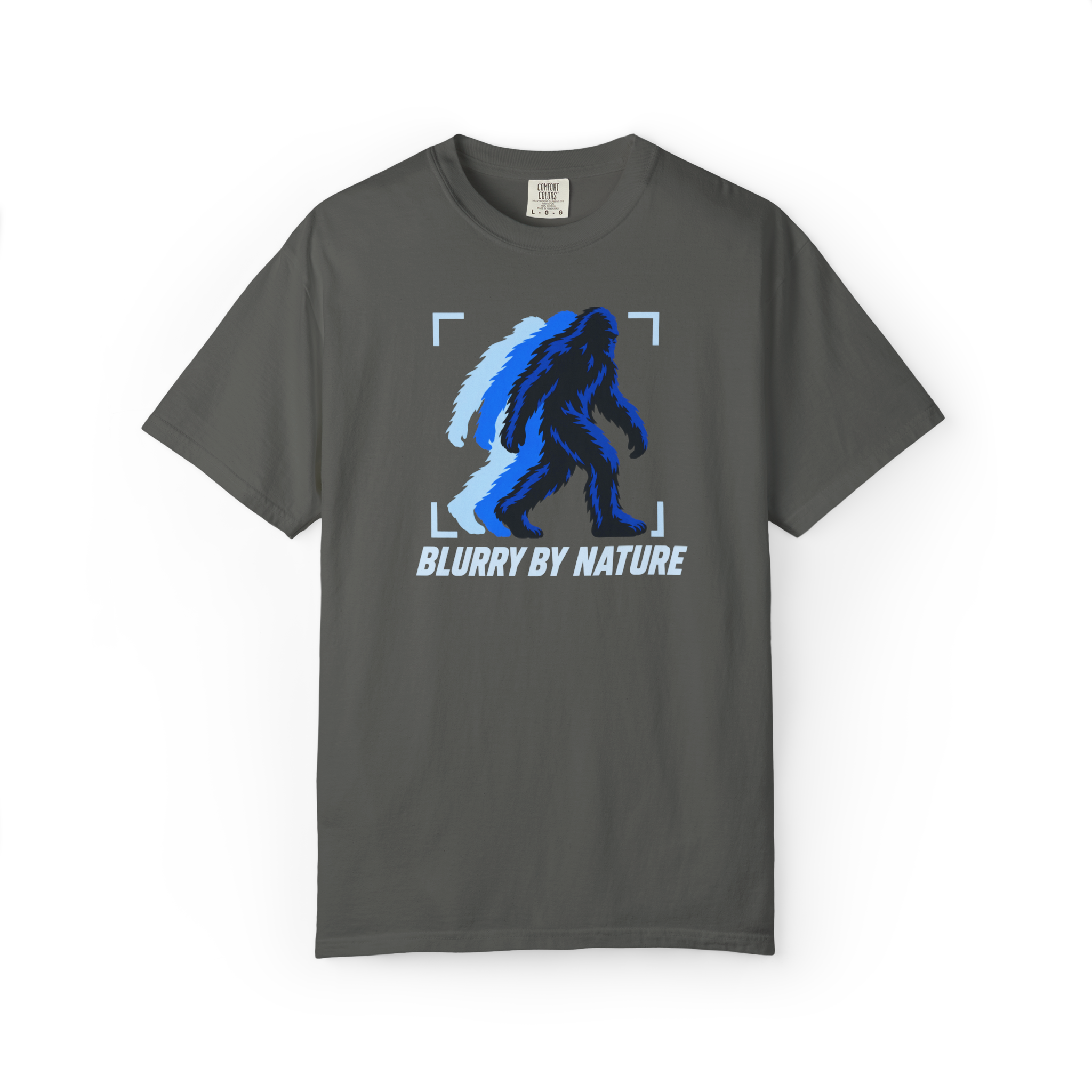 Pepper Bigfoot t shirt featuring a blue blurred walking Sasquatch inside camera focus corners with Blurry By Nature text
