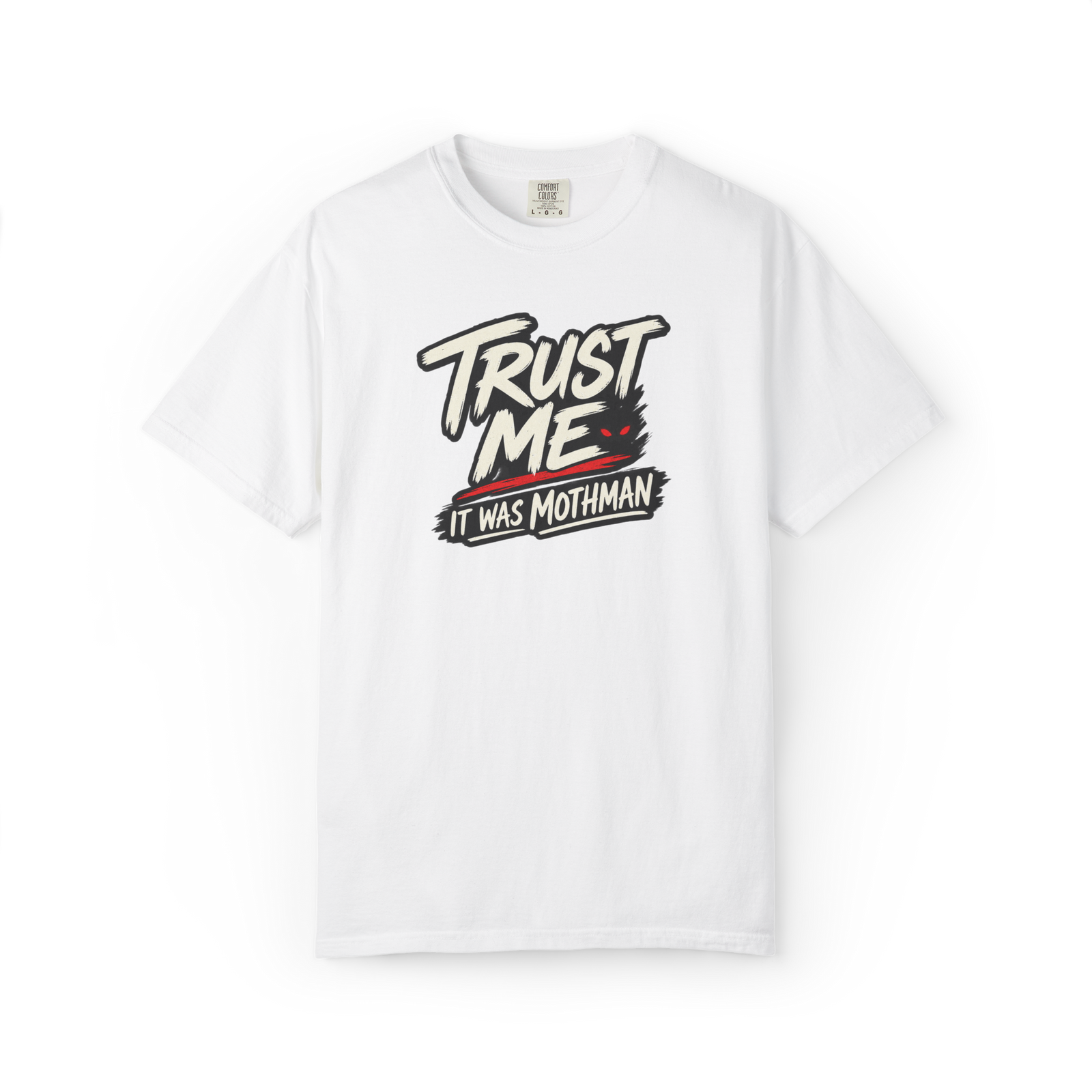White Mothman t shirt with Trust Me It Was Mothman text in black and cream with a small red-eyed cryptid detail