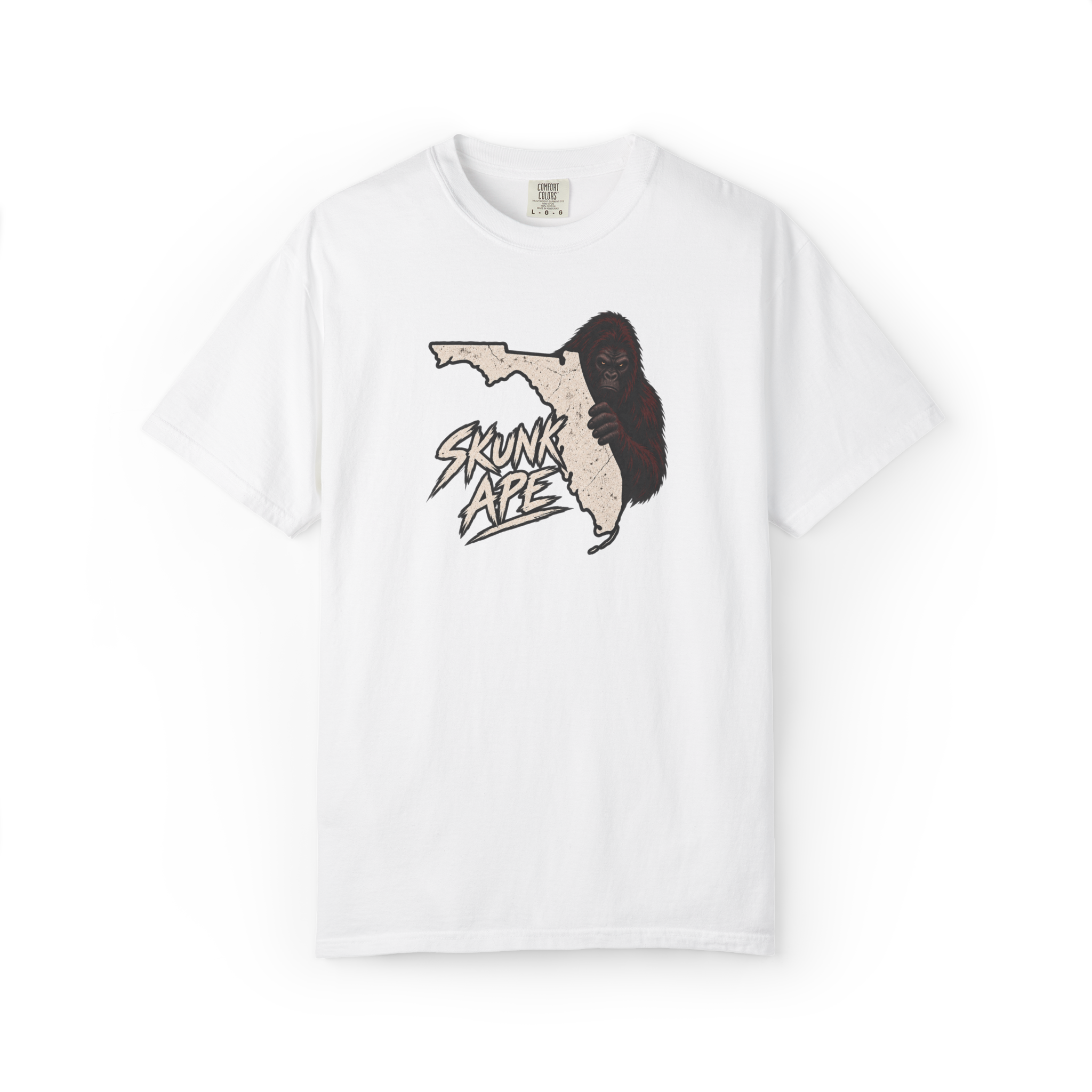 White Skunk Ape t shirt with a distressed Florida state outline, peeking red-brown skunk ape, and Skunk Ape text