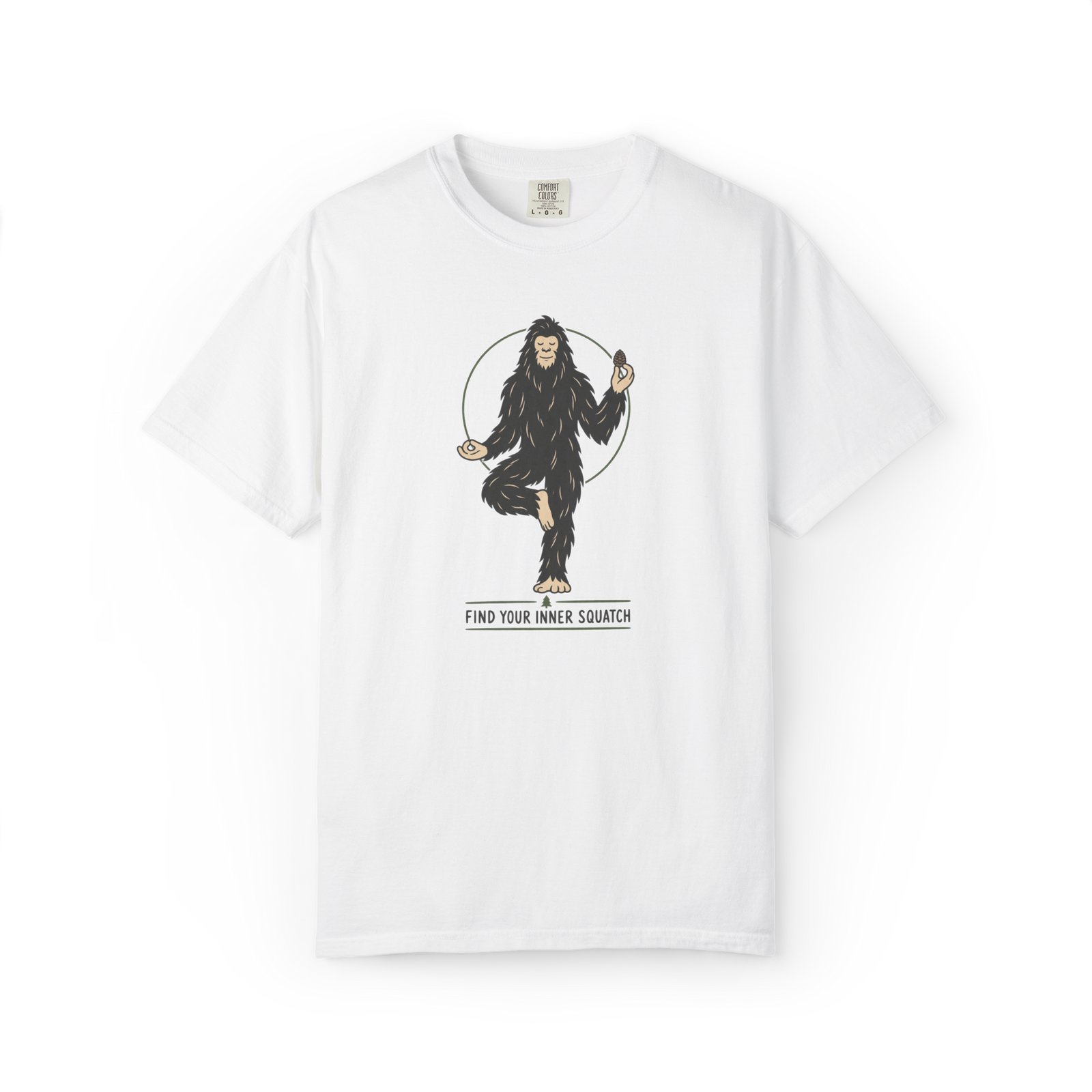 White Bigfoot t shirt featuring a meditating Sasquatch in a yoga pose holding a pine cone with Find Your Inner Squatch text