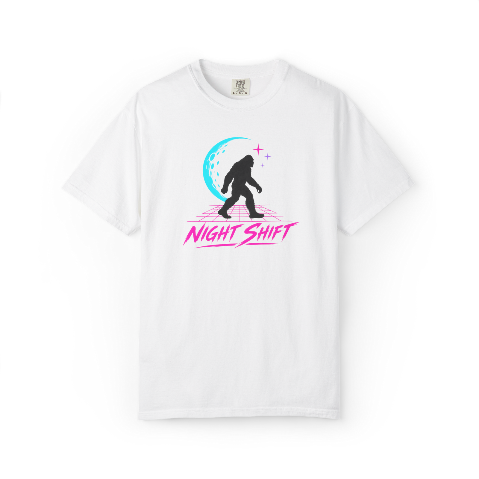 White Bigfoot t shirt featuring a walking Sasquatch silhouette, cyan crescent moon, pink retro grid, stars, and Night Shift text