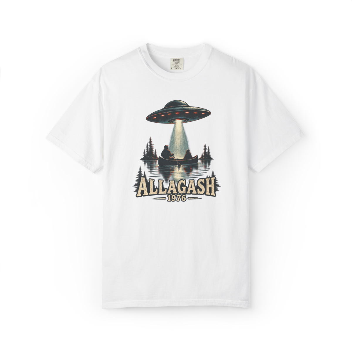 White shirt featuring an Allagash 1976 UFO design with two people in a canoe under a hovering saucer beam on a lake